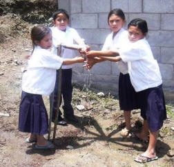 students in La Canada try their new water spigot